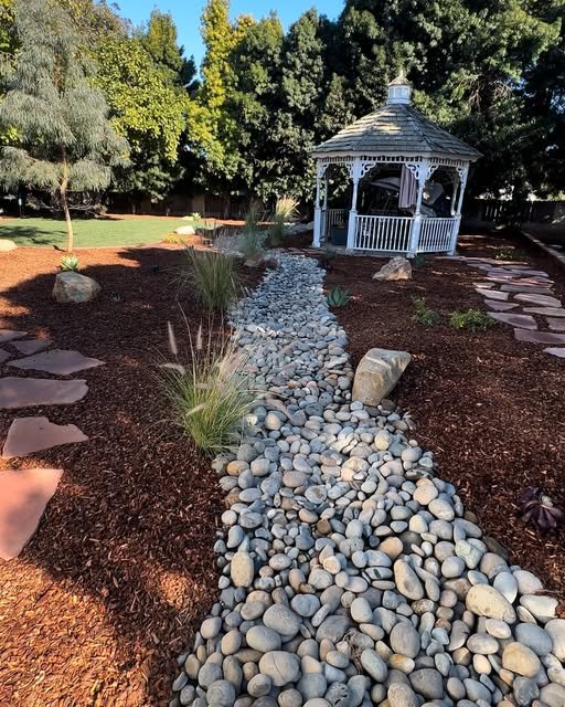 Dry creek bed with gazebo and flagstone path