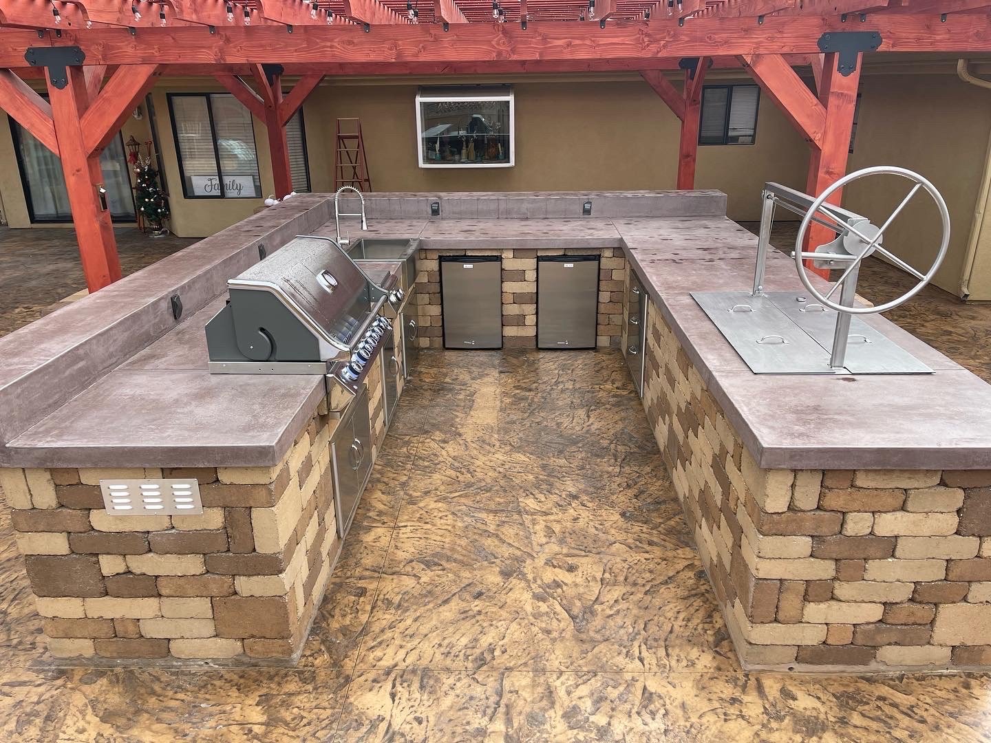 Custom outdoor kitchen build with BBQ grill and countertop